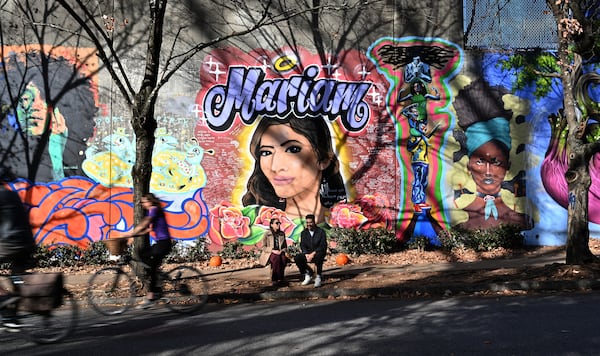 Ali Abdulrab and Asya Morgan talk in front of the mural of the murder victim Abdulrab's sister, Mariam, on Wylie Street near the Krog Street tunnel. Ali Abdulrab and Asya Morgan have become activists seeking to strengthen the way the state oversees sex offenders. (Hyosub Shin / Hyosub.Shin@ajc.com)