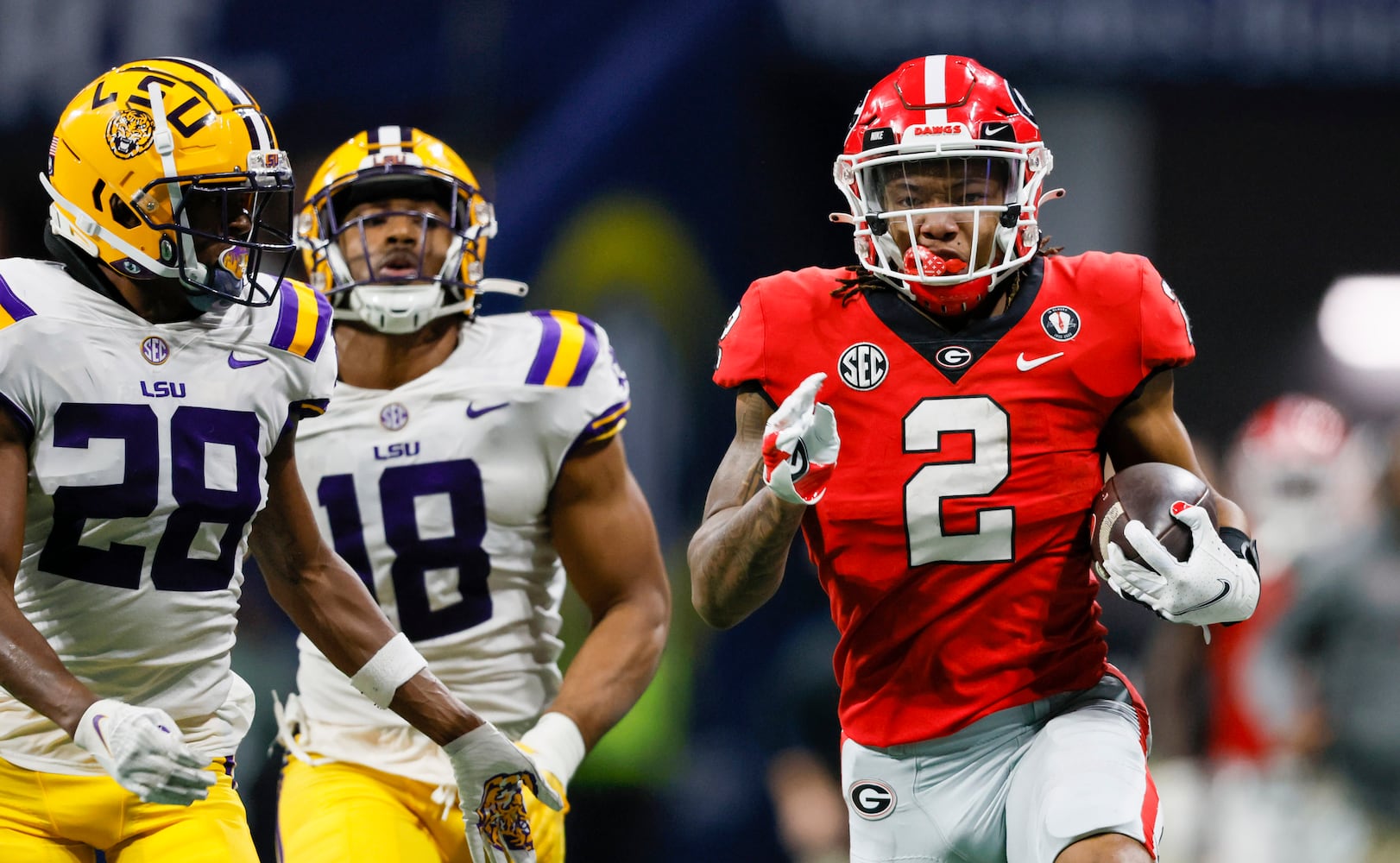 Georgia Bulldogs running back Kendall Milton (2) runs for a 51-yard gain against the LSU Tigers during the second half of the SEC Championship Game at Mercedes-Benz Stadium in Atlanta on Saturday, Dec. 3, 2022. (Jason Getz / Jason.Getz@ajc.com)