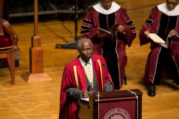 At the beginning of the service, Morehouse College's Dean of the Chapel, Reverend Dr. Lawrence Edward Carter Sr., starts the event with a prayer. Chad Rhym/ chad.rhym@ajc.com