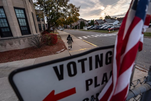 A voter leaves a polling site after casting a ballot on Election Day, Tuesday, Nov. 5, 2024, in Dearborn, Mich., the nation's largest Arab-majority city. (AP Photo/David Goldman)