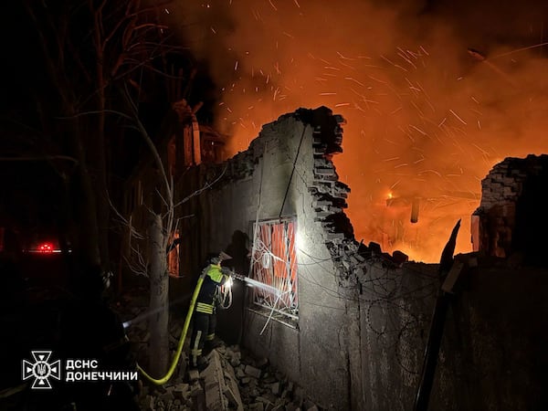 In this photo provided by the Ukrainian Emergency Service, firefighters put out the fire following a Russian attack in Dobropillya, Donetsk region, Ukraine, Thursday, March 20, 2025. (Ukrainian Emergency Service via AP)