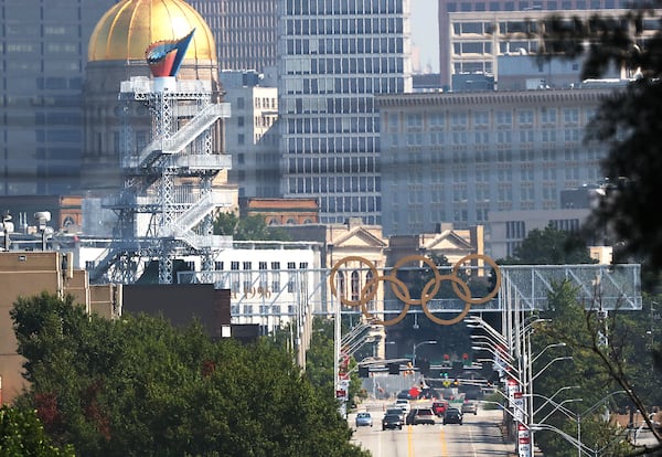 The Olympic cauldron and rings are seen against the Atlanta skyline on Monday, August 2, 2021, in Atlanta. Curtis Compton / Curtis.Compton@ajc.com