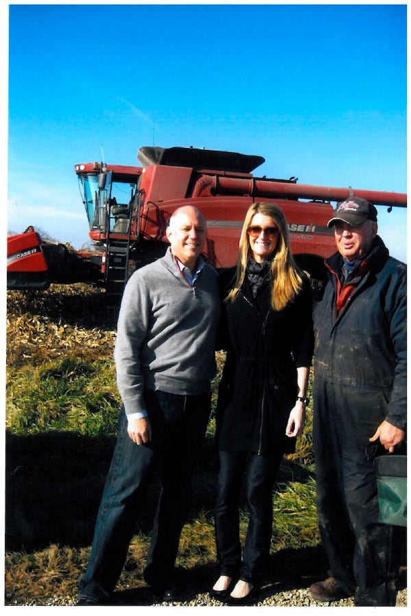 From left in this 2009 photo are InternationalExchange CEO Jeff Sprecher, his wife Kelly Loeffler, who is an ICE vice president and co-owner of the Atlanta Dream, and her father, Don Loeffler.