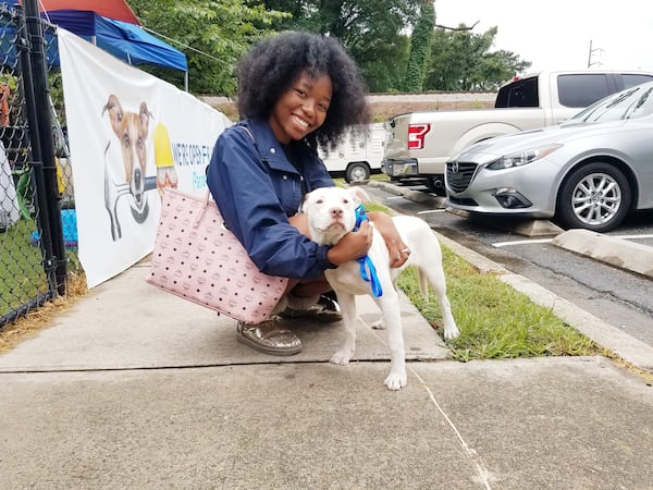 Anna and her new owner after being adopted.