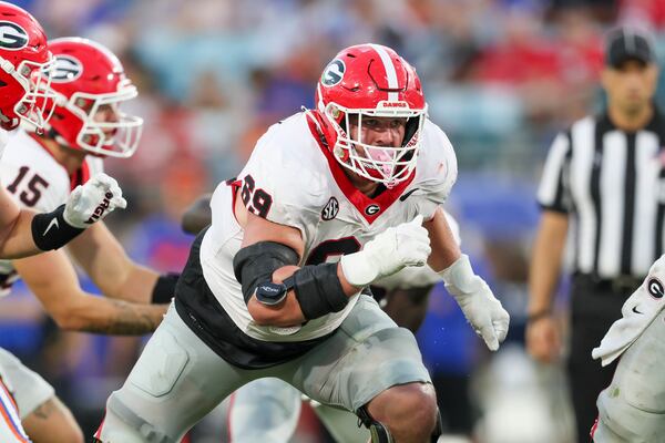 Georgia offensive lineman Tate Ratledge (69) blocks during their game against Florida at EverBank Stadium, Saturday, October 27, 2023, in Jacksonville, Fl. Georgia won 43-20 against Florida. (Jason Getz / Jason.Getz@ajc.com)