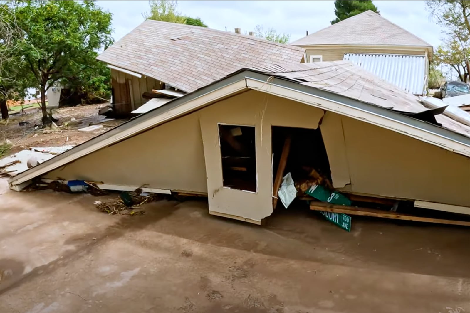 In this image taken from video, debris and damage and are seen from severe flooding in Roswell, N.M., Sunday, Oct. 20, 2024. (Juliana Halvorson via AP)