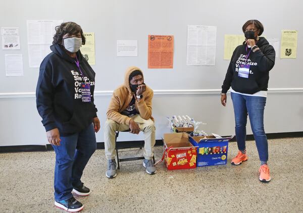 (From left to right) Rev. Martha Simmons, Rev. Allison Henderson-Brooks and John Wiggins wait to distribute snacks to voters during election day on Tuesday, November 3, 2020, at Ben Robertson Community Center in Kennesaw, Georgia. Ministers and seminary students were sent to polling locations throughout the state to monitor, offer encouragement and diffuse tense situations as a part of the New Georgia Project’s Faith Initiative. CHRISTINA MATACOTTA FOR THE ATLANTA JOURNAL-CONSTITUTION.
