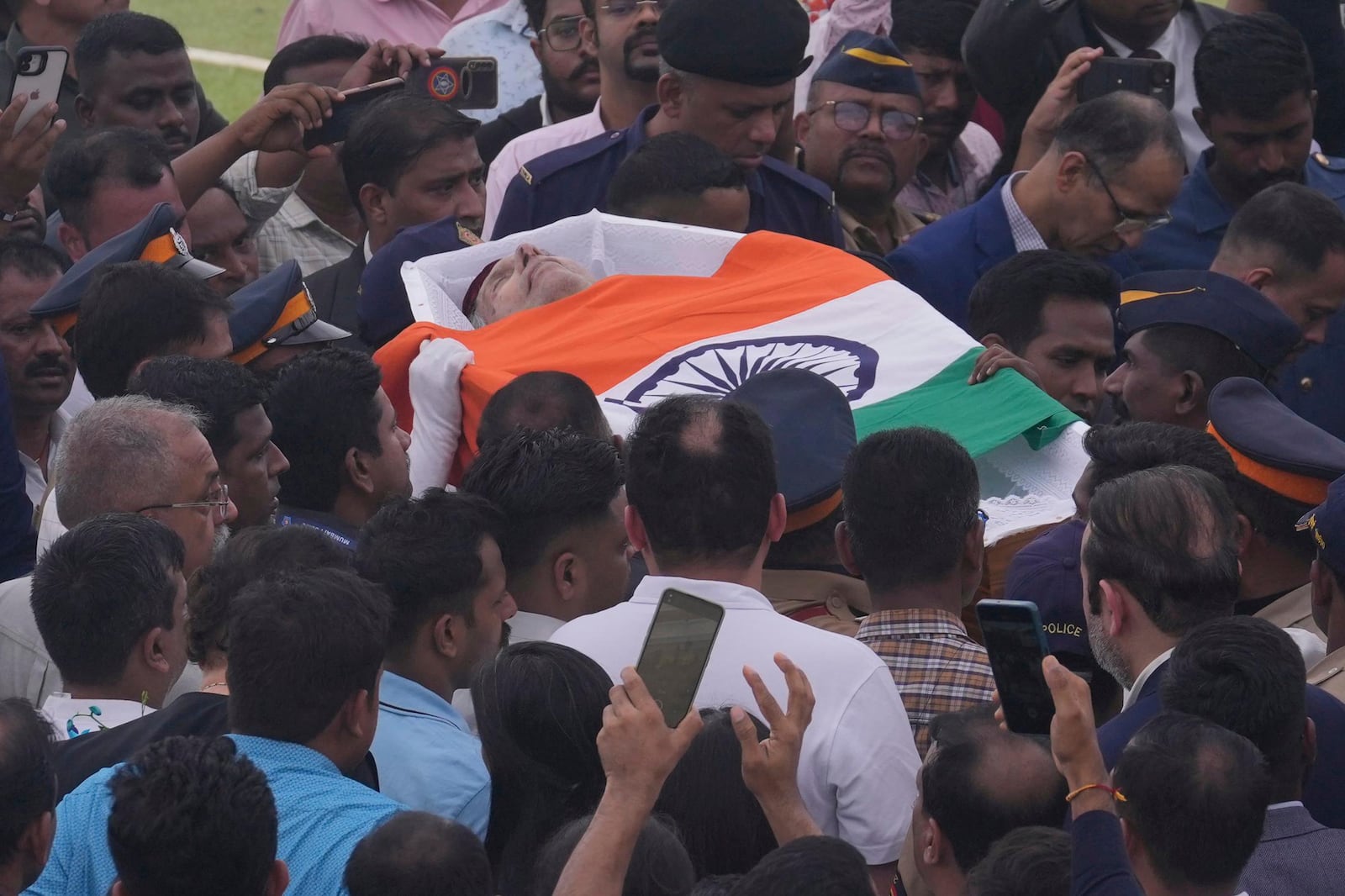 Body of Indian business leader Ratan Tata who died on Wednesday night is taken for cremation with full state honors, in Mumbai, India, Thursday, Oct. 10, 2024. (AP Photo /Rafiq Maqbool)