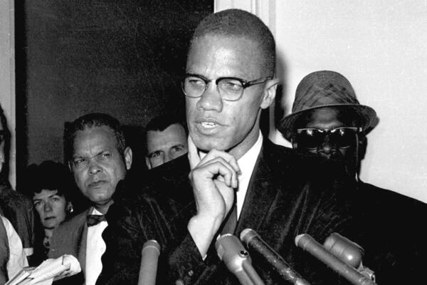 FILE - Malcolm X speaks to reporters in Washington, D.C., May 16, 1963. (AP Photo, File)