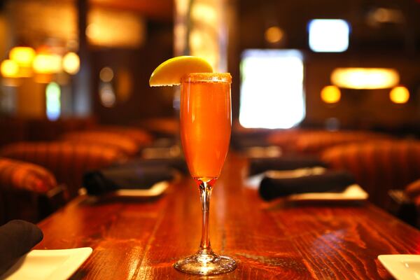 The Apple Pie Mimosa from Spice Brick Oven Kitchen Tapas & Bar blends crisp champagne with fresh apple cider for a refreshing fall take on the classic mimosa. Credit: Courtesy of Spice Brick Oven Kitchen Tapas & Bar