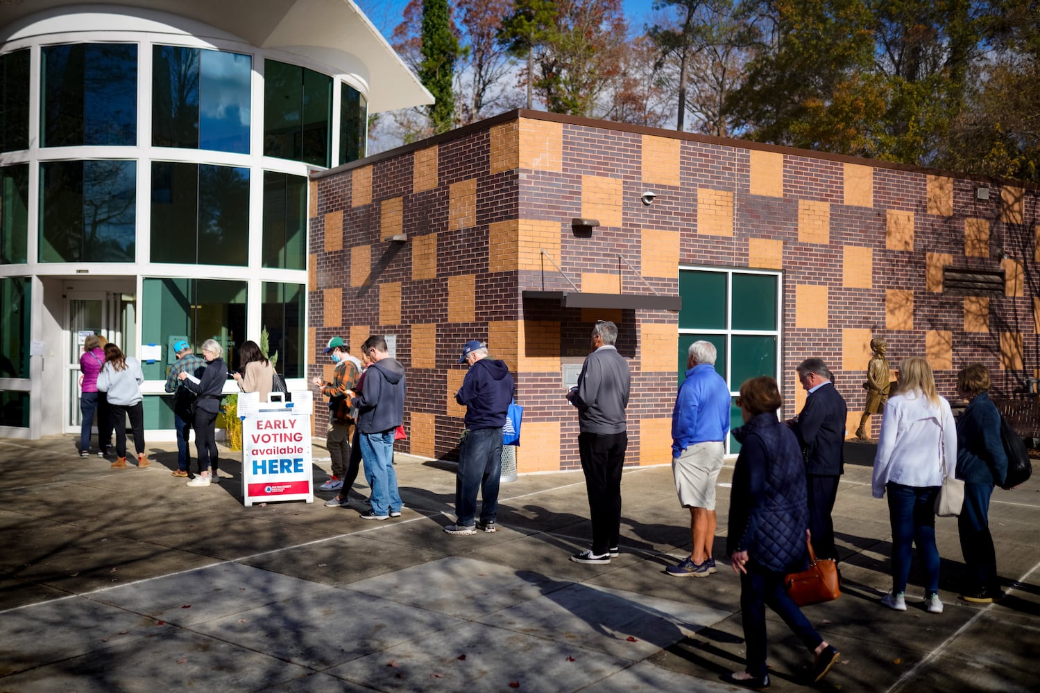 Fulton county residents take advantage of early voting Monday morning in Atlanta. Lines stretched out the door at the Northside branch library on Monday, Nov. 28, 2022.  (Ben Hendren for the Atlanta Journal Constitution) 