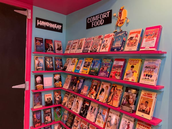 Since his basement had a kitchen, Woodstock's Anthony SantAnselmo created a "food themed" section in his fake video rental store. RODNEY HO/rho@ajc.com