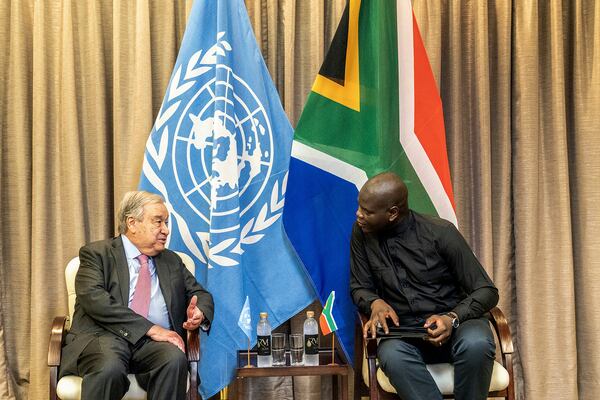 South African Minister of International Relations and Cooperation, Ronald Lamola, right, and the Secretary General of the United Nations, Antonio Guterres, left, talk during their meeting in Pretoria, South Africa. Wednesday, Dec. 11, 2024. (AP Photo/Shiraaz Mohamed)