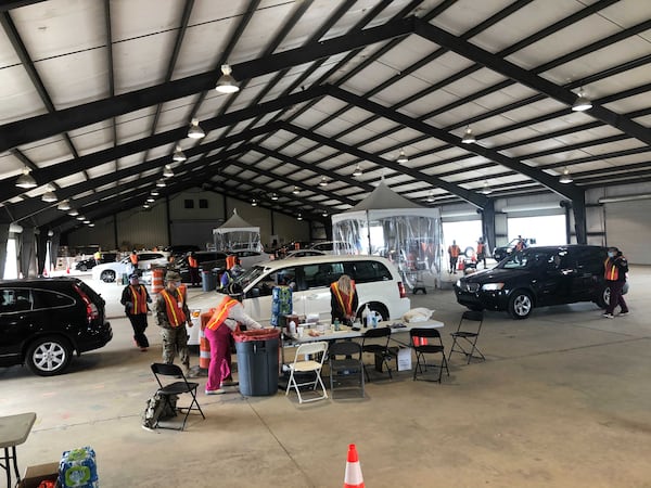 Operations at the mass vaccination site at Habersham County Fairgrounds in Clarkesville went smoothly Monday. With expanded eligibility, the daily number of vaccines administered was more than doubled to 2,100, the site manager said. (Helena Oliviero / Helena.Oliviero@ajc.com)