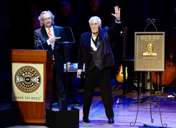 ADDS YEAR - FILE - In this Oct. 27, 2013, file photo, country music star Kenny Rogers thanks the audience at the ceremony for the 2013 inductions into the Country Music Hall of Fame in Nashville, Tenn. Actor-singer Kenny Rogers, the smooth, Grammy-winning balladeer who spanned jazz, folk, country and pop with such hits as âLucille,â âLadyâ and âIslands in the Streamâ and embraced his persona as âThe Gamblerâ on record and on TV died Friday night, March 20, 2020. He was 81. (AP Photo/Mark Zaleski, File)