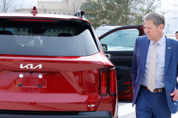 Kia executives met with Gov. Brian Kemp and state leaders Wednesday to show off the first electric vehicles built in Georgia. Pictured is Kemp on Kia Day at the state Capitol on Jan. 31, 2023. (Natrice Miller / natrice.miller@ajc.com) 