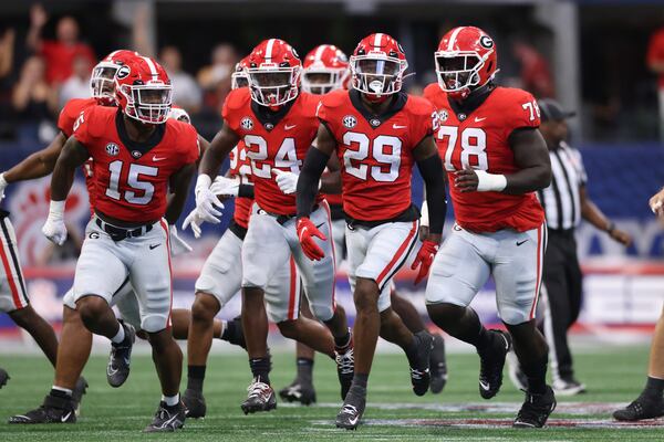 090322 Atlanta.: Georgia Bulldogs defensive back Christopher Smith (29) celebrates his interception with linebacker Trezmen Marshall (15), defensive back Malaki Starks (24) and defensive lineman Nazir Stackhouse (78) during the second quarter against the Oregon Ducks in the Chick-fil-A Kickoff game at Mercedes Benz Stadium, Saturday, September 3, 2022, in Atlanta. (Jason Getz / Jason.Getz@ajc.com)