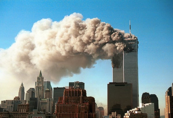 Smoke pours from the World Trade Center after it was hit by two hijacjked passenger planes September 11, 2001 in New York City in a terrorist attack. (Photo by Robert Giroux/Getty Images)