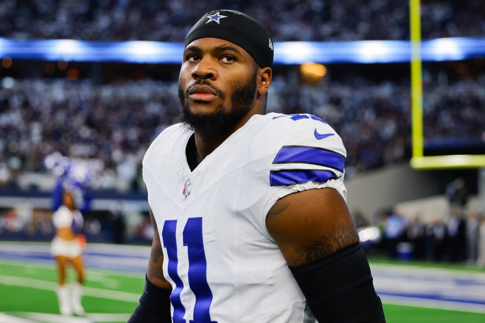 FILE - Dallas Cowboys linebacker Micah Parsons looks into the stands before an NFL football game against the Baltimore Ravens, Sept. 22, 2024 in Arlington, Texas. (AP Photo/Gareth Patterson, File)