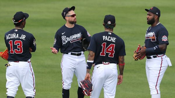 Braves outfielders Ronald Acuna (from left), Ender Inciarte, Cristian Pache, and Marcell Ozuna confer in the outfield during team practice Wednesday, Feb. 24, 2021, at CoolToday Park in North Port, Fla. (Curtis Compton / Curtis.Compton@ajc.com)