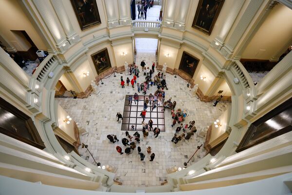 Visitors and lobbyists are seen at the Capitol rotunda during Crossover Day in Atlanta.