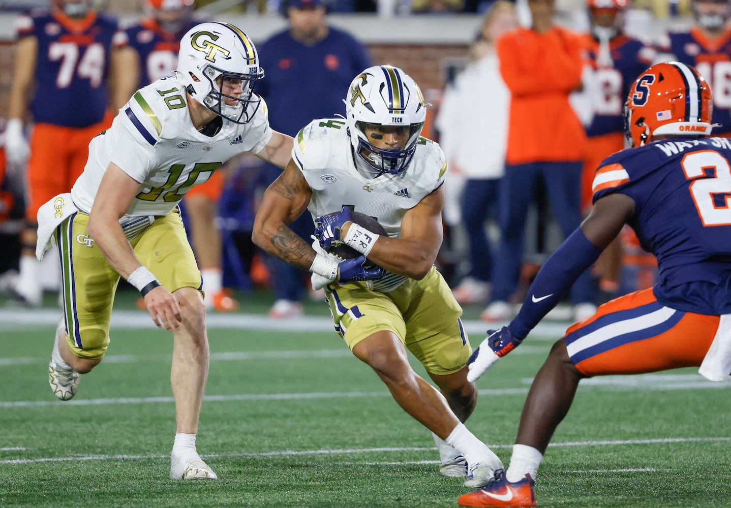 Georgia Tech Yellow Jackets running back Dontae Smith (4) takes the handoff from quarterback Haynes King (10) during the second half of an NCAA college football game between Georgia Tech and Syracuse in Atlanta on Saturday, Nov. 18, 2023.  Georgia Tech won, 31 - 22. (Bob Andres for the Atlanta Journal Constitution)