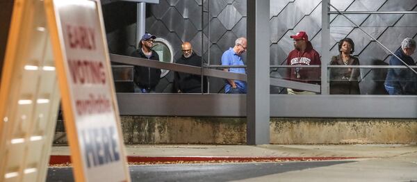 Several dozen voters were ready in the first hour of early voting at the Buckhead Library in Atlanta on Monday, Oct. 17, 2022. (John Spink / John.Spink@ajc.com) 

