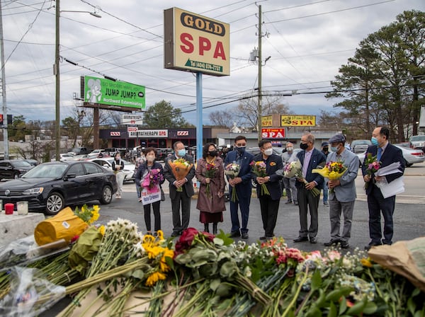 03/19/2021 —Atlanta, Georgia — Members of the the Atlanta Korean-American Committee against Asian Hate Crimes hold a vigil for the victims of the spa shootings outside of the Gold Spa in Atlanta, Friday, March 19, 2021. The committee consists of Korean-American community members, business leaders and religious leaders.  (Alyssa Pointer / Alyssa.Pointer@ajc.com)