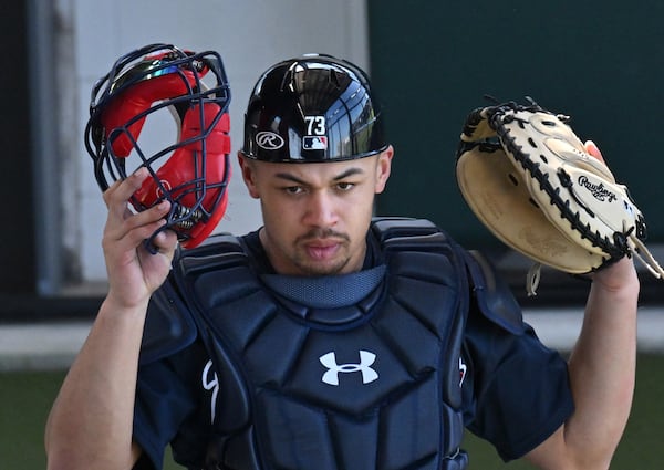 Atlanta Braves catcher Drake Baldwin watches his teammates during Braves spring training at CoolToday Park, Saturday, Feb. 18, 2023, in North Port, Fla.. (Hyosub Shin / Hyosub.Shin@ajc.com)