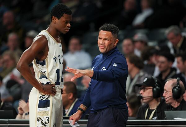 Georgia Tech head coach Damon Stoudamire talks with Georgia Tech guard Kowacie Reeves Jr. (14) during Tech’s loss to Wake Forest during the second half at McCamish Pavilion, Tuesday, February 6, 2024, in Atlanta. Wake Forest won 80-51. (Jason Getz / Jason.Getz@ajc.com)