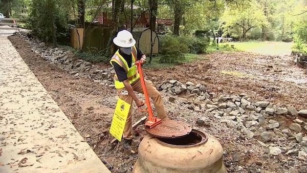 A worker tends to a DeKalb-area sewer project in 2022. 