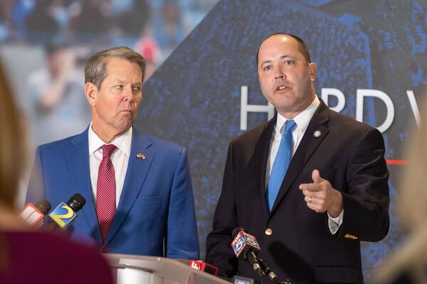 Georgia Gov. Brian Kemp and Attorney General Chris Carr speak to media after an anti-gang summit at Georgia State University in Atlanta on Feb. 7, 2023.  Carr's office has forwarded a GBI report on election interference in Coffee County to the Fulton County District Attorney. (Arvin Temkar/The Atlanta Journal-Constitution/TNS)