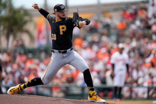 FILE - Pittsburgh Pirates starting pitcher Paul Skenes (30) delivers during the first inning of a spring training baseball game against the Baltimore Orioles, Saturday, March 1, 2025, in Sarasota, Fla. (AP Photo/Stephanie Scarbrough, File)