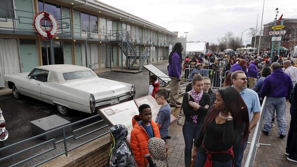 FILE - In this Monday, Jan. 16, 2017, file photo, people wait in line to enter the National Civil Rights Museum on Martin Luther King Jr. Day in Memphis, Tenn. The site is among about 130 locations in 14 states being promoted as part of the new U.S. Civil Rights Trail, which organizers hope will boost tourism in the region. (AP Photo/Mark Humphrey, File)