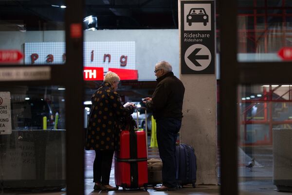 Travelers wait at the designated rideshare area at Hartsfield-Jackson Atlanta International Airport , Monday, Jan. 2, 2017, in Atlanta. BRANDEN CAMP/SPECIAL