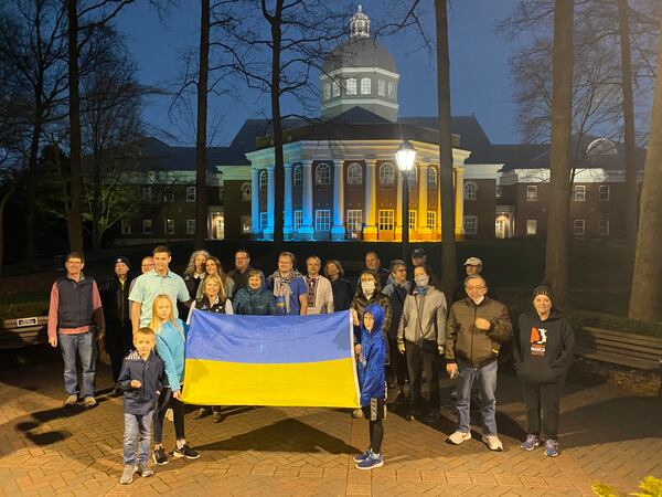 The colors of the Ukrainian flag first appeared Friday night when City Council members Will Morthland, Christine Hall and Lee Hills were gathered outside City Hall with about 30 people showing support for the country and local residents of Ukranian roots. Credit Adrianne Murchison