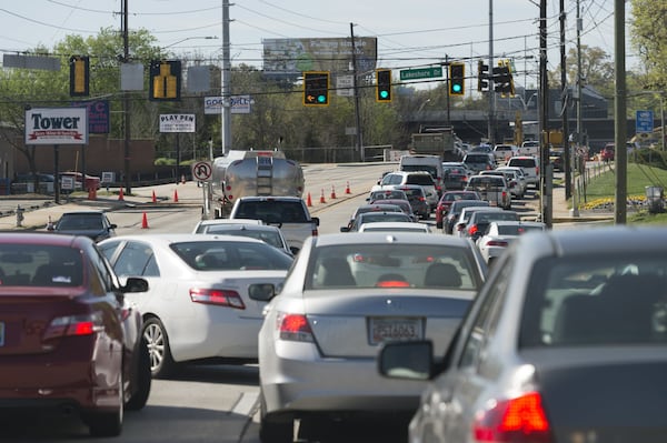 Cars and trucks stack up Sunday in the southbound lanes of Piedmont Road, near the collapse site. (DAVID BARNES / DAVID.BARNES@AJC.COM)