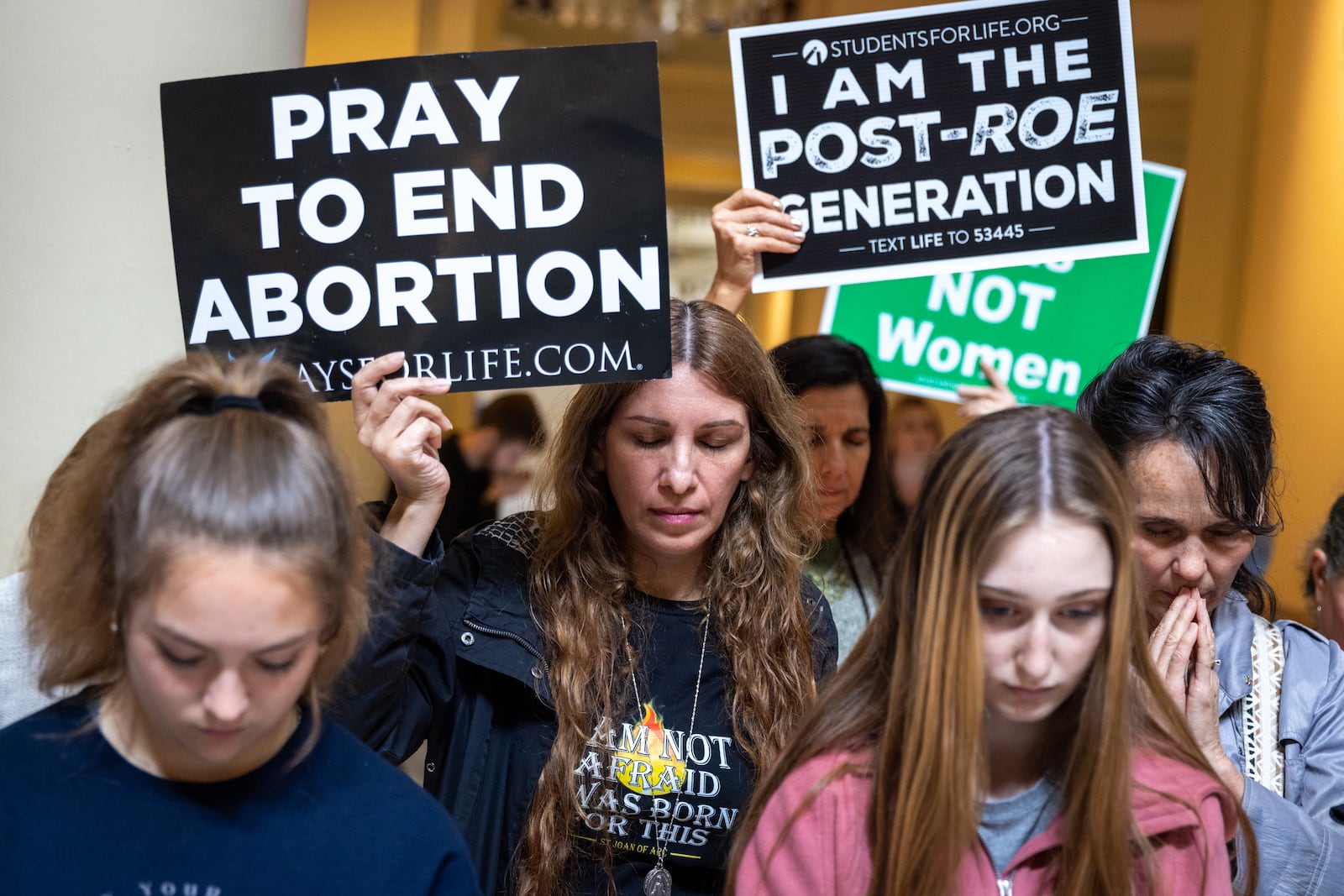 Anti-abortion activists pray at an anti-abortion rally at the Georgia State Capitol in Atlanta on Feb. 9, 2023. (Arvin Temkar/AJC)