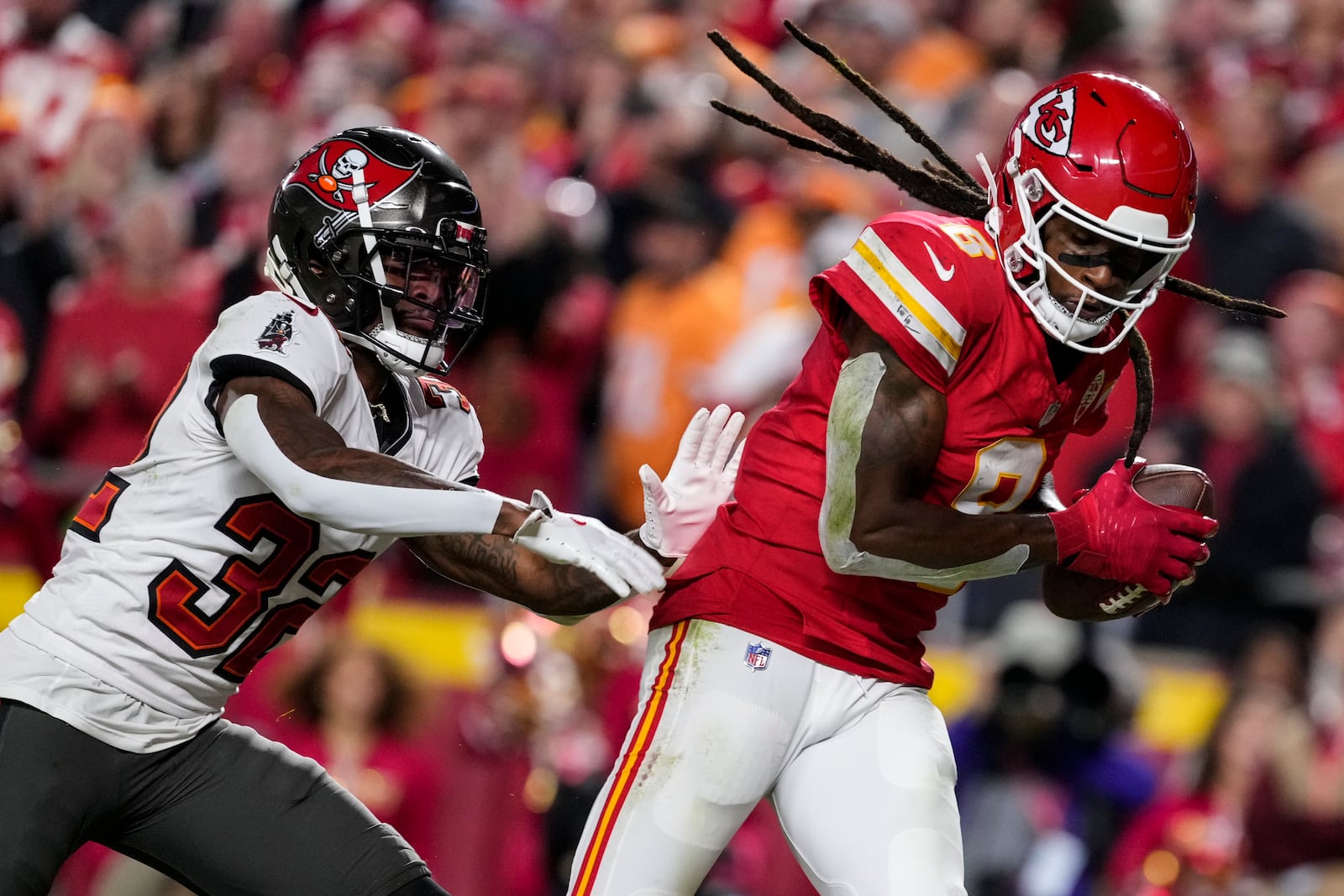 Kansas City Chiefs wide receiver DeAndre Hopkins (8) scores a touchdown against Tampa Bay Buccaneers safety Josh Hayes (32) during the first half of an NFL football game, Monday, Nov. 4, 2024, in Kansas City, Mo. (AP Photo/Ed Zurga)