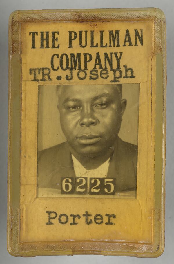 This ID badge from circa 1940 was used by T.R. Joseph, a porter with the Pullman Company. The back of the badge identified Joseph's age (36), height, weight, eye and hair color. (Sam Patton/Collection of the Smithsonian National Museum of African American History and Culture)