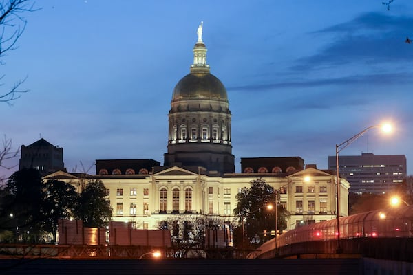 The sun sets behind the Georgia State Capitol on Crossover Day, day 28 of the legislative session, on Monday, March 6, 2023, in Atlanta. Jason Getz / Jason.Getz@ajc.com)
