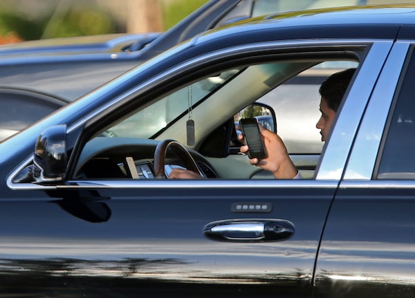 Georgia new distracted driving law takes effect July 1. JASON GETZ / JGETZ@AJC.COM