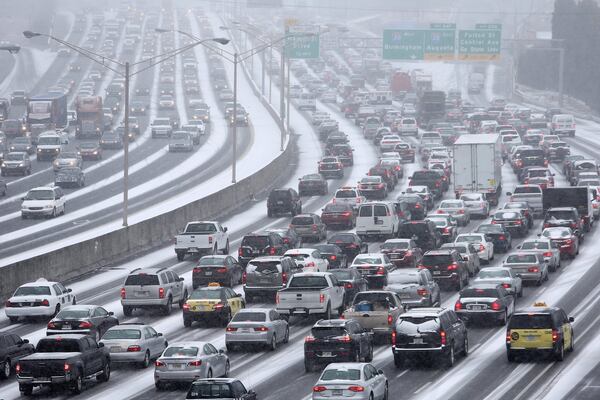 Jan. 28, 2014 Atlanta: Traffic inches along the Connector as snow blankets metro Atlanta as seen from the Pryor Street overpass. BEN GRAY / BGRAY@AJC.COM