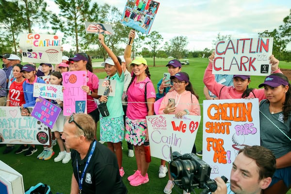 Fans of WNBA basketball player Caitlin Clark, of the Indiana Fever, congregate at the fourth tee during the pro-am at the LPGA Tour golf tournament, Wednesday, Nov 13, 2024, at the Pelican Golf Club in Belleair, Fla. (Douglas R. Clifford/Tampa Bay Times via AP)