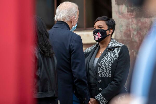 12/15/2020 —  Atlanta, Georgia — Atlanta Mayor Keisha Lance Bottoms has a conversation with President-Elect Joseph Biden following his remarks during a “Get Ready to Vote” rally for Georgia Democrat U.S. Senator candidates Rev. Raphael Warnock and Jon Ossoff at Pratt-Pullman Yard in Atlanta’s Kirkwood neighborhood, Tuesday, December 15, 2020.  (Alyssa Pointer / Alyssa.Pointer@ajc.com)