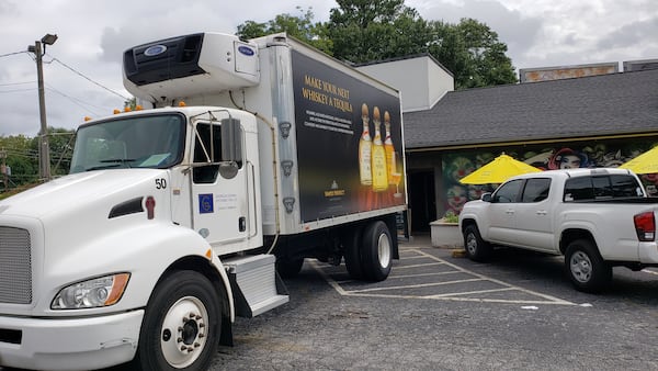 Tequila sales have increased this summer, said Doug Hertz, president and CEO of United Distributors, the largest alcoholic beverage wholesaler in Georgia and Alabama. Here, a distributor makes a delivery to My Parents' Basement in Avondale Estates. 