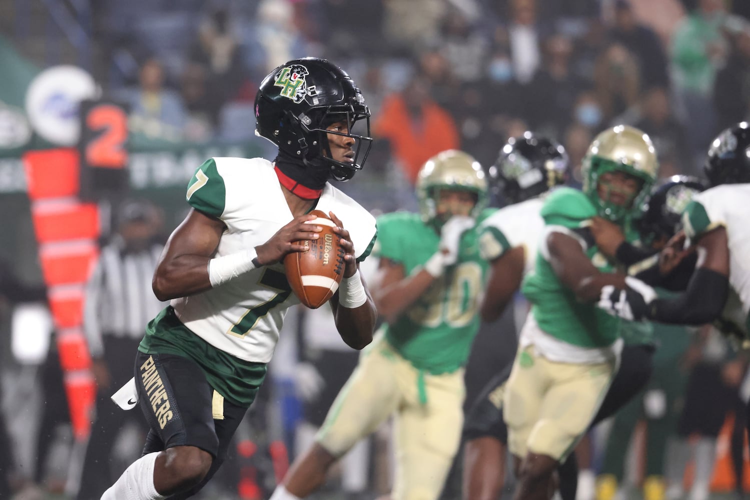 Langston Hughes quarterback Prentiss Noland (7) looks to pass during the first half against Buford in the Class 6A state title football game at Georgia State Center Parc Stadium Friday, December 10, 2021, Atlanta. JASON GETZ FOR THE ATLANTA JOURNAL-CONSTITUTION