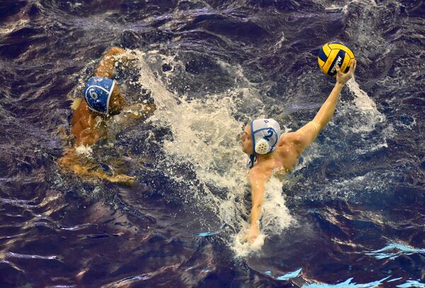 Members of the Rainbow Trout Water Polo team play a mini game during their practice. (Hyosub Shin / Hyosub.Shin@ajc.com)