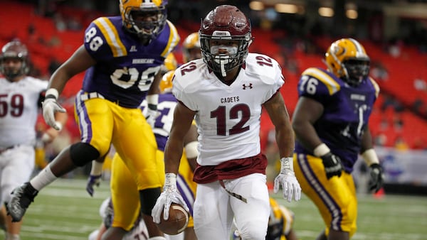 Benedictine running back John Wesley Kennedy III (12) celebrates his touchdown run against Fitzgerald during the Class AA state championship game Dec. 10, 2016, at the Georgia Dome in Atlanta. (Jason Getz/Special to AJC)