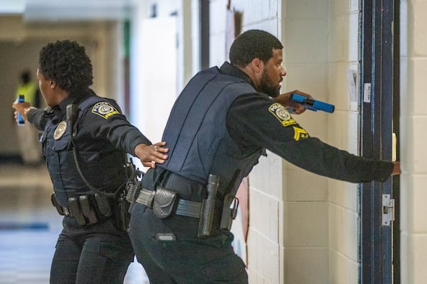 Atlanta Public Schools police officers participate in an active shooter training drill at the former Towns Elementary School in Atlanta on Thursday, July 28, 2022. (Steve Schaefer / steve.schaefer@ajc.com)